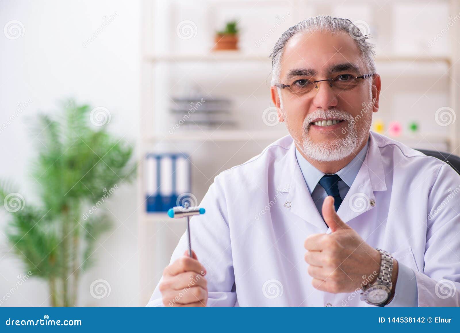 The Aged Male Doctor with Hammer Stock Photo Image of medicine