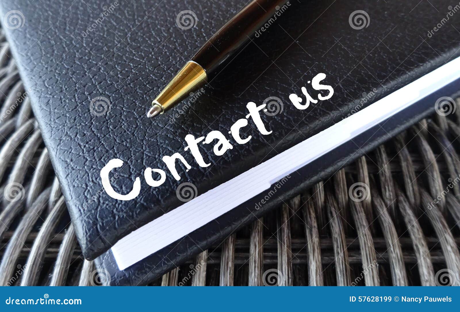 contact us concept with agenda and pen.