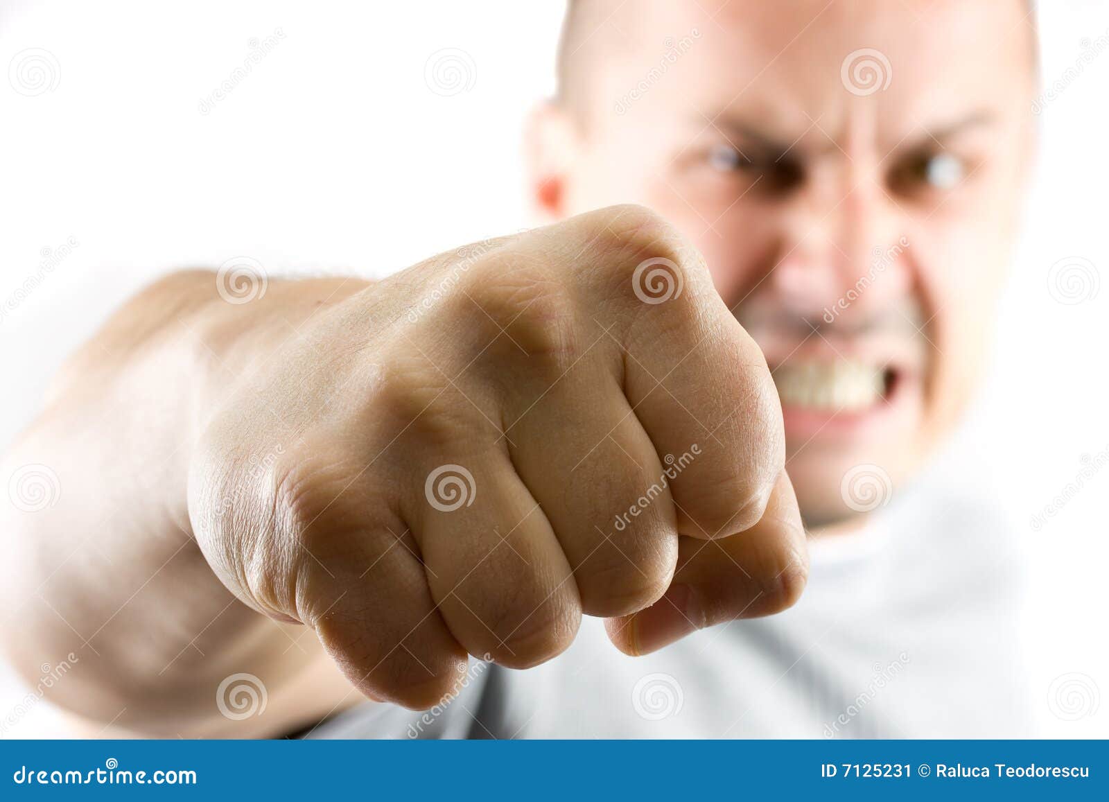 aggressive man showing his fist  on white