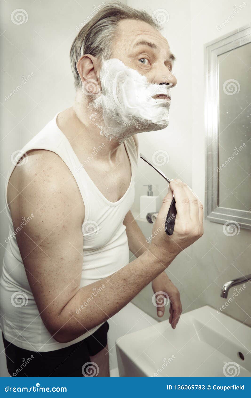 Older Man Using a Razor To Shave Himself Cut Himself and Bleed ...