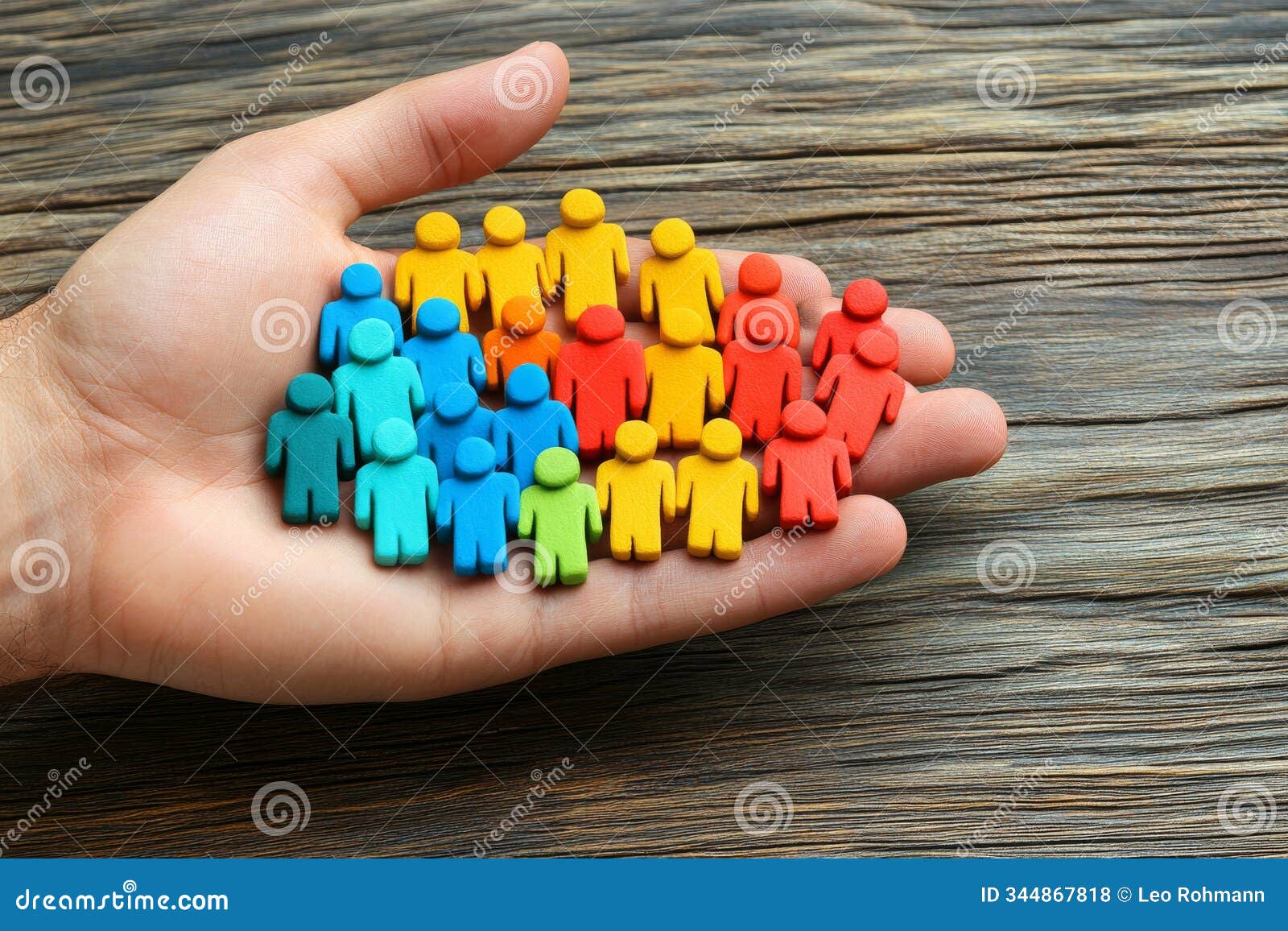 hand holding a colorful cluster of small human figures izing diversity community and collective strength in a vibrant con