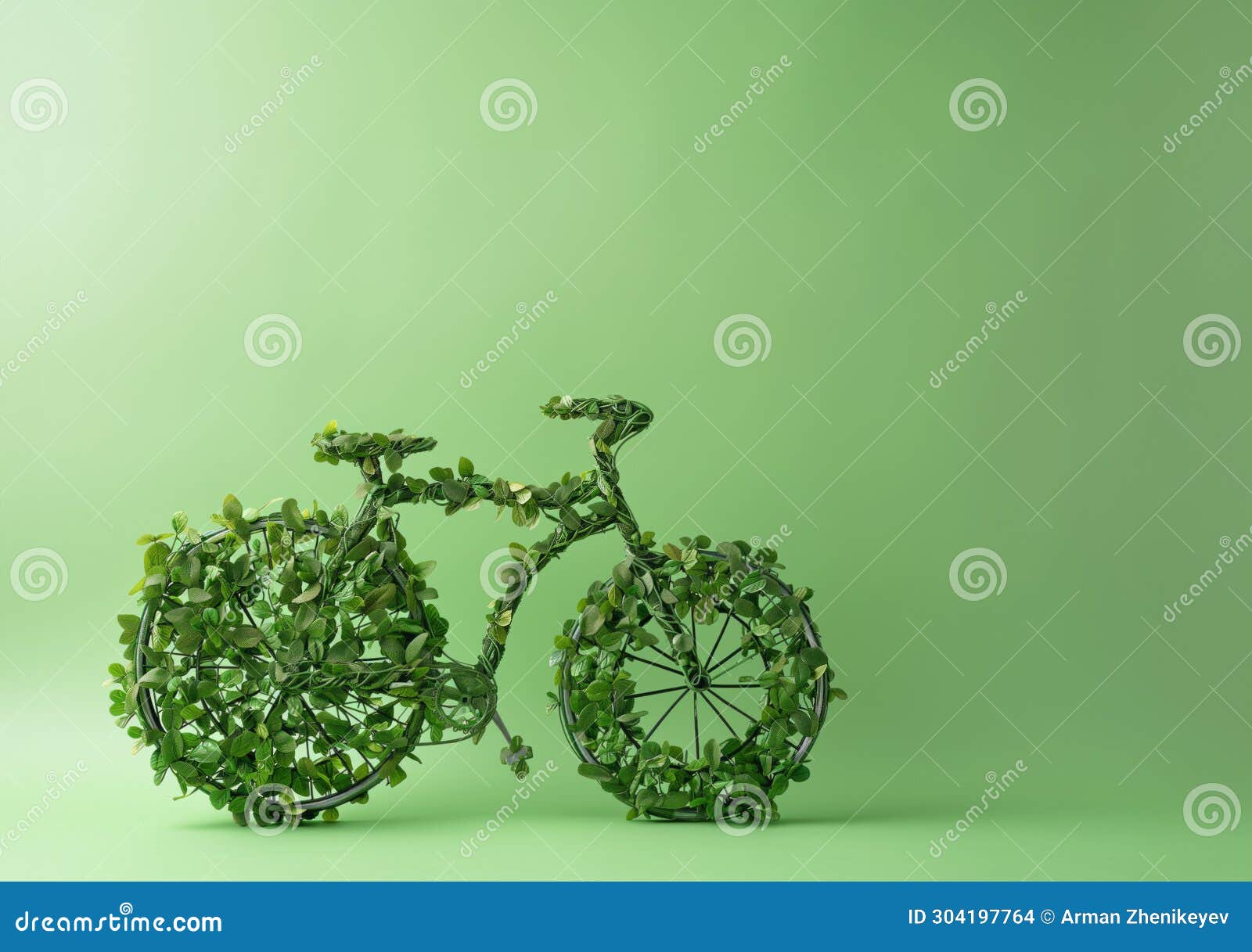 model of bicycle made of leaves and plants against a green wall. earth day and environmentalism concept