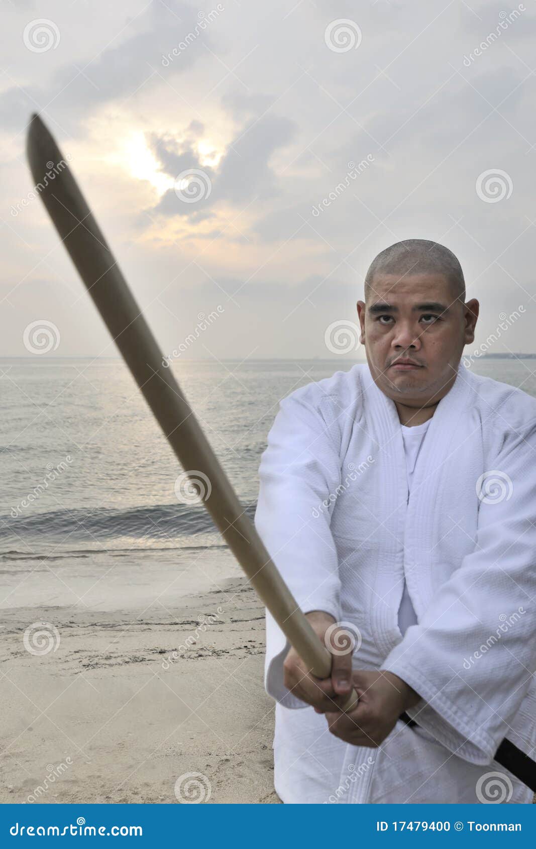 Aikido man with bokken stock photo. Image of martial 17479400