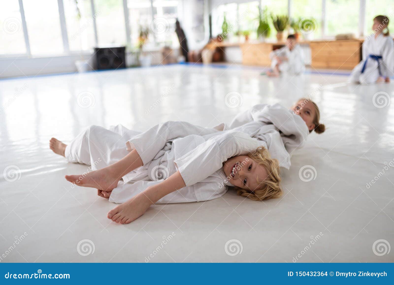 Boy and Girl Practicing Aikido Movements Together Stock Photo Image