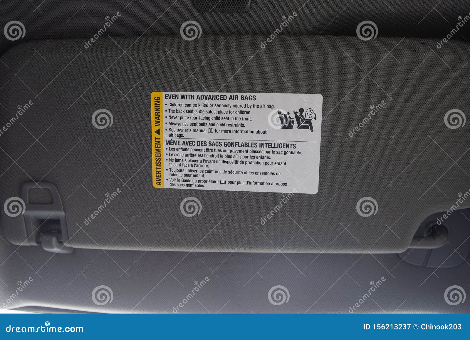 Air Bag Warning Label on New Vehicle Visor Warning of Child Placement