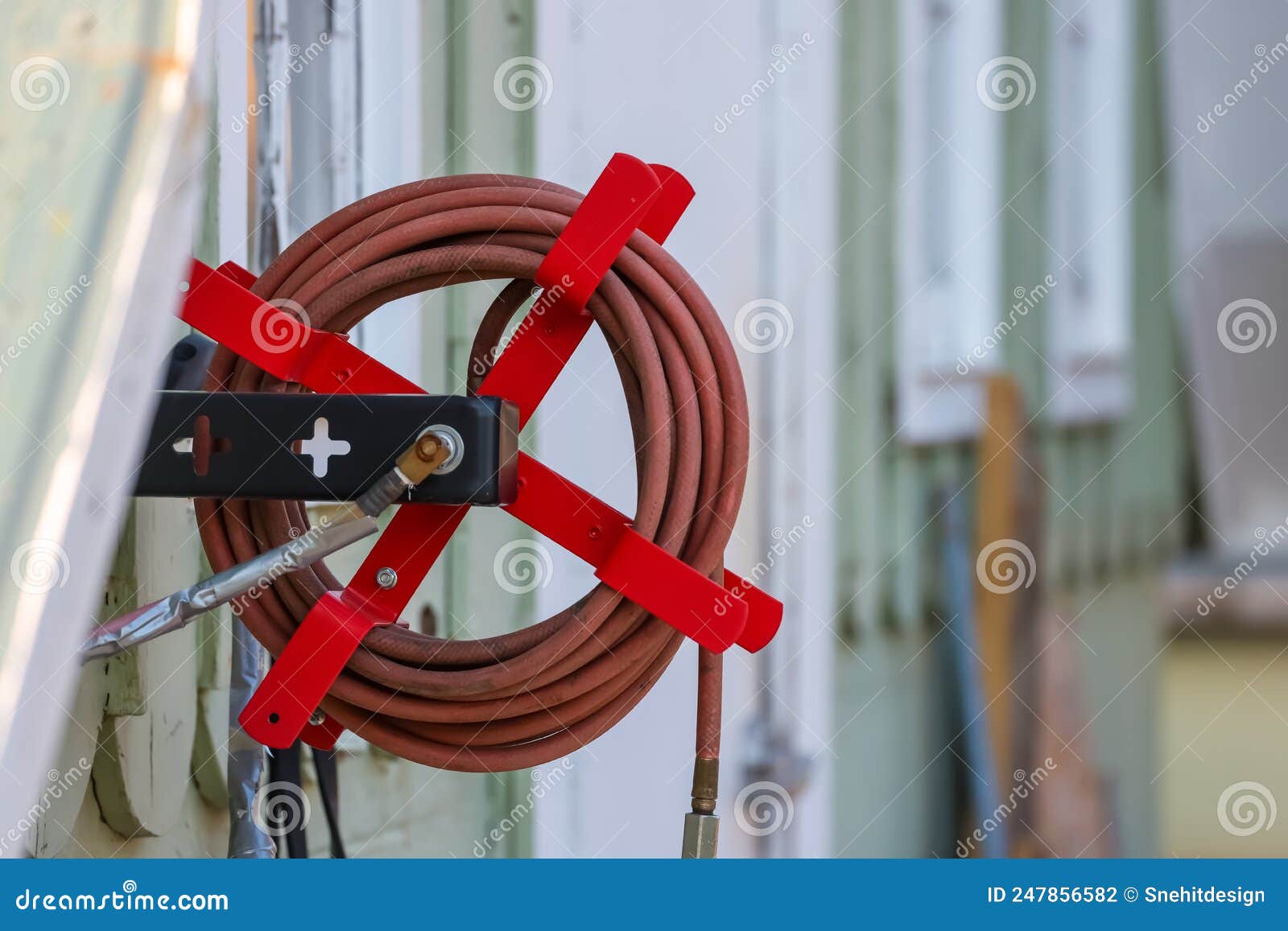 Air Compressor Hose Holder on the Wall Stock Photo - Image of pump