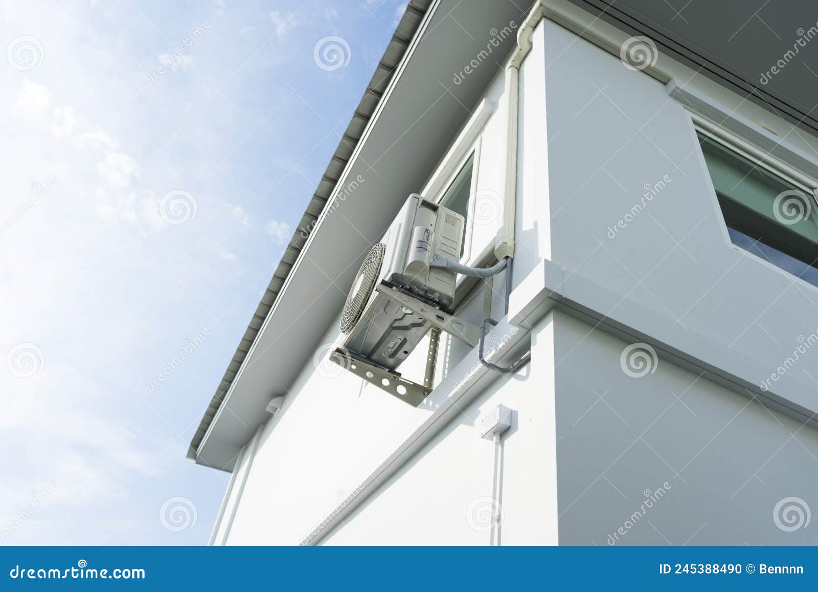 Split Air Conditioner Closeup Repair And Maintenance Concept. The Specialist Repairs The Wall