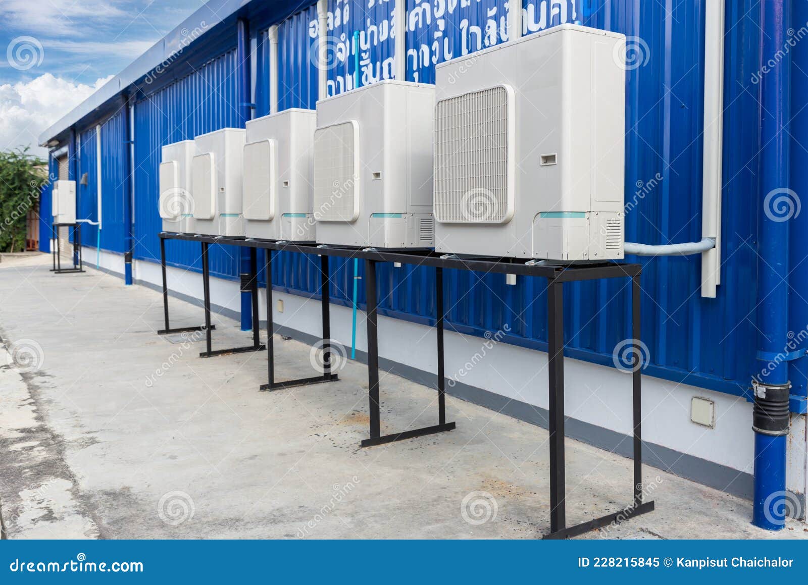 Air Conditioner Compressor Installed in Old Building. Outdoor Split Wall Type Air Conditioner