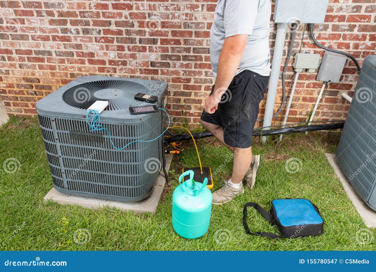 Air Conditioner Maintenance With Technician Adding Refrigerant Royalty