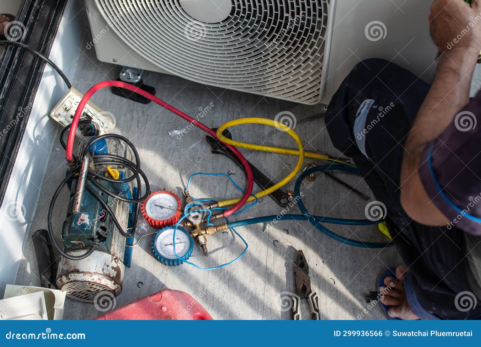 air conditioning, hvac service technician using gauges to check refrigerant