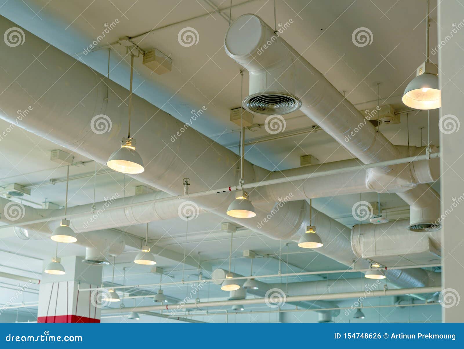air duct, wiring and plumbing in the mall. air conditioner pipe, wiring pipe, and plumbing pipe system. ceiling lamp light with