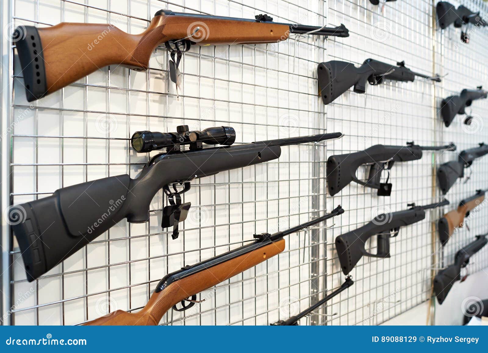 Air guns on stand in shop stock image. Image of wood 89088129