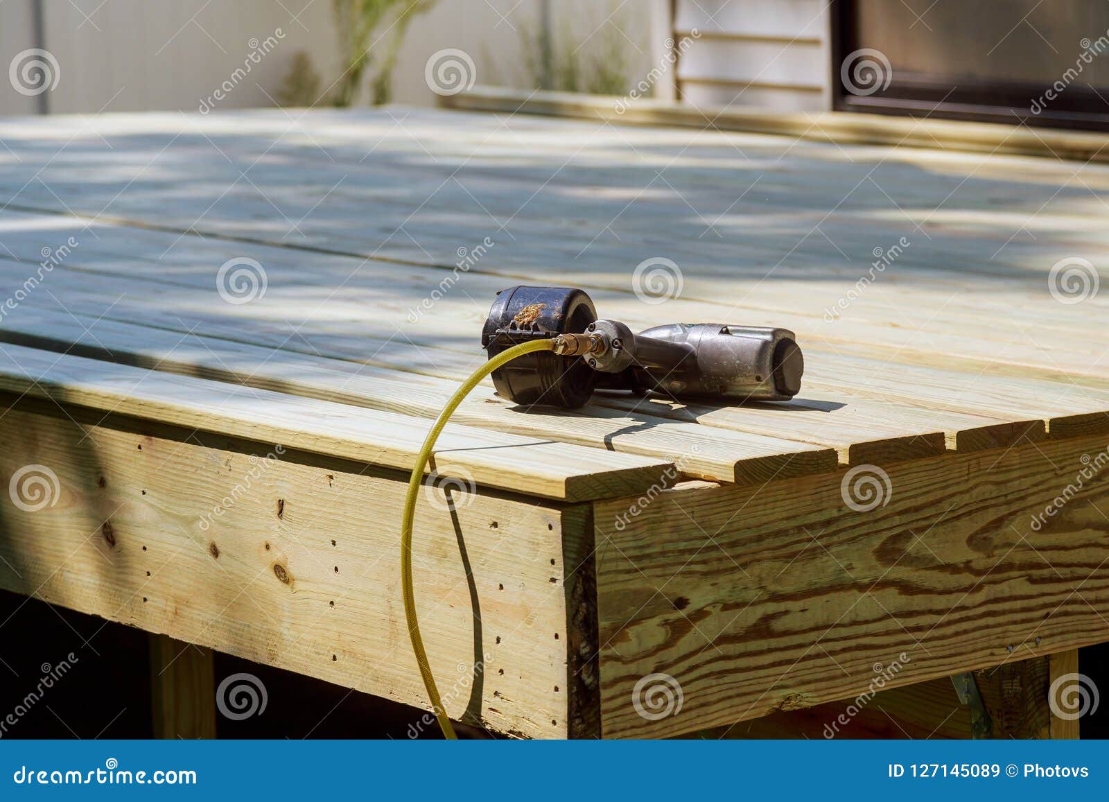Worker Installing Wooden Floor Air Nail Gun on the Stock Image Image
