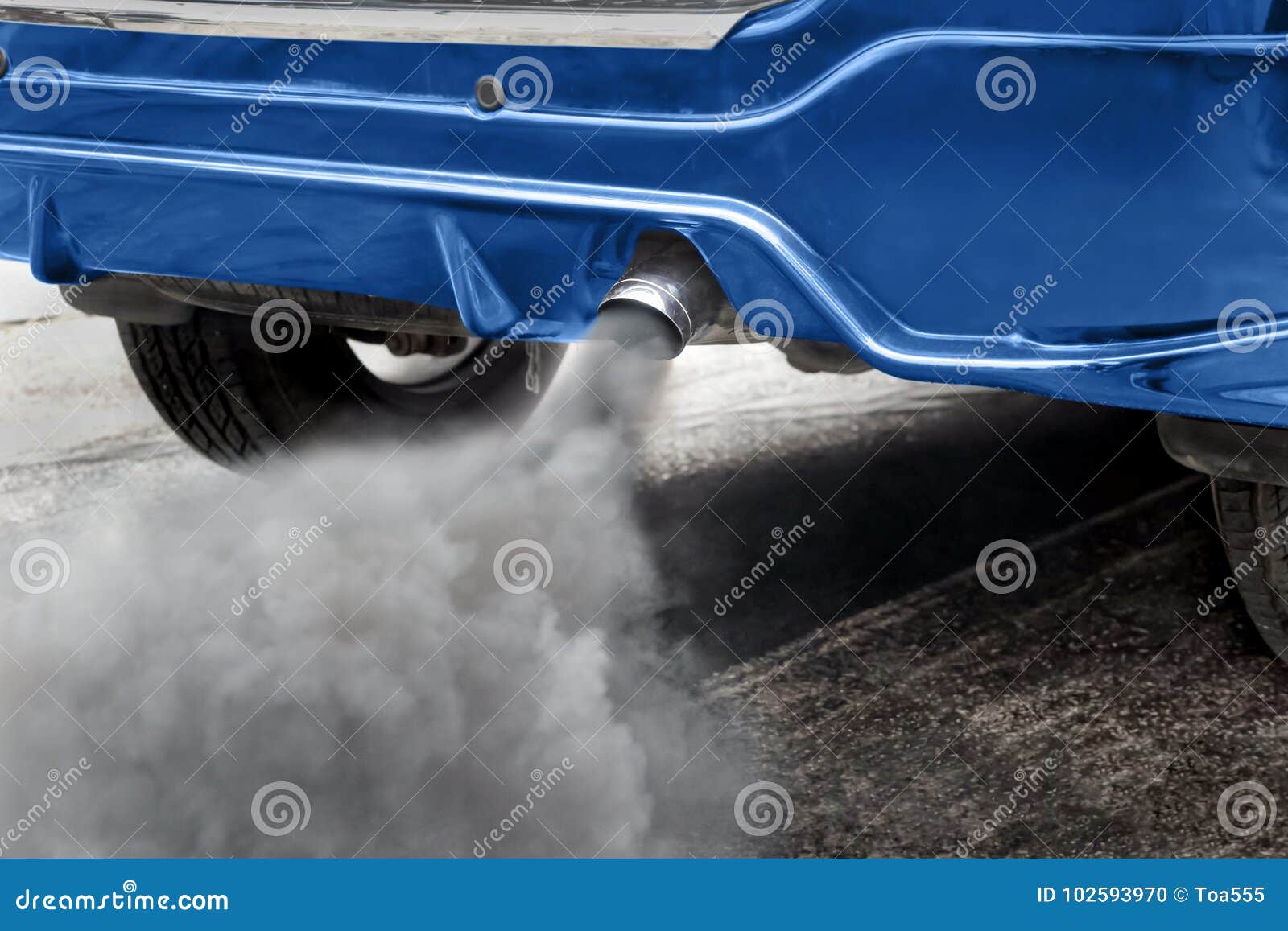 air pollution from vehicle exhaust pipe on road