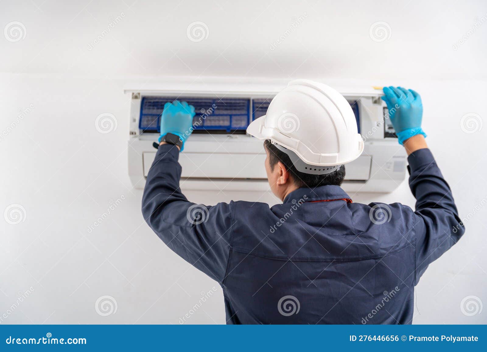 Air Technician Service Checking and Repairing Air Conditioner on White