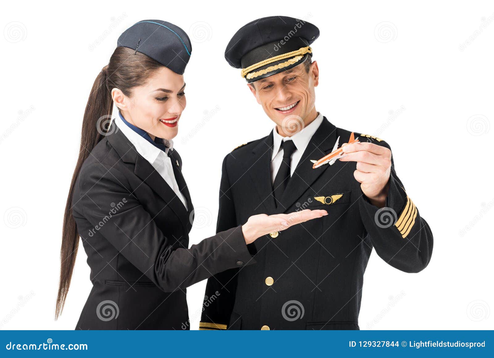 Airline Captain and Stewardess Holding Toy Plane Stock Photo - Image of  aviator, profession: 129327844