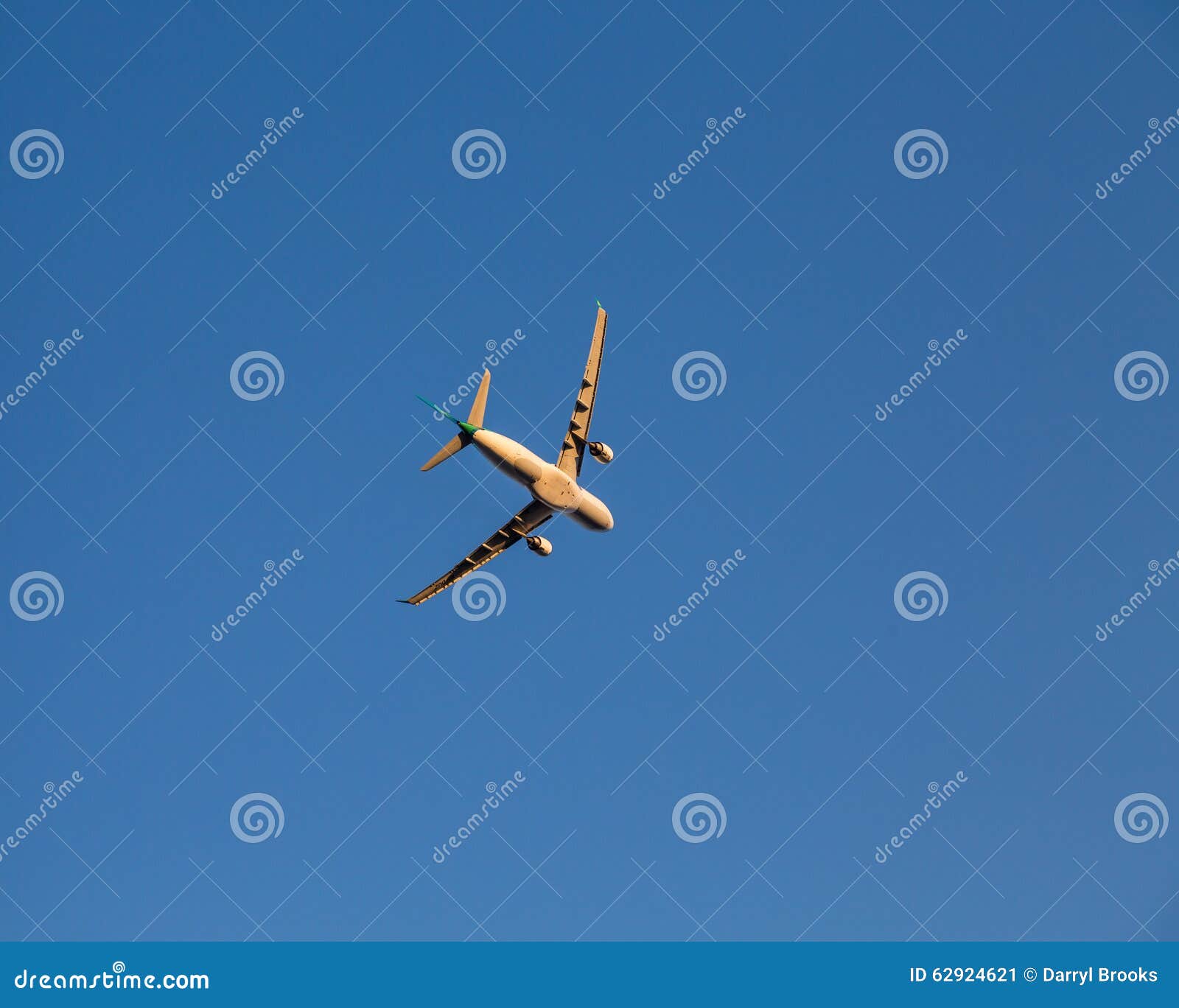 Airplane Banking for a Turn Against a Blue Sky Stock Image Image of