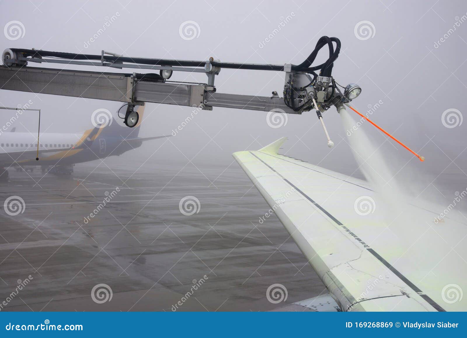 Airplane is Being Prepared for Flight. the Wing is Sprayed by Special
