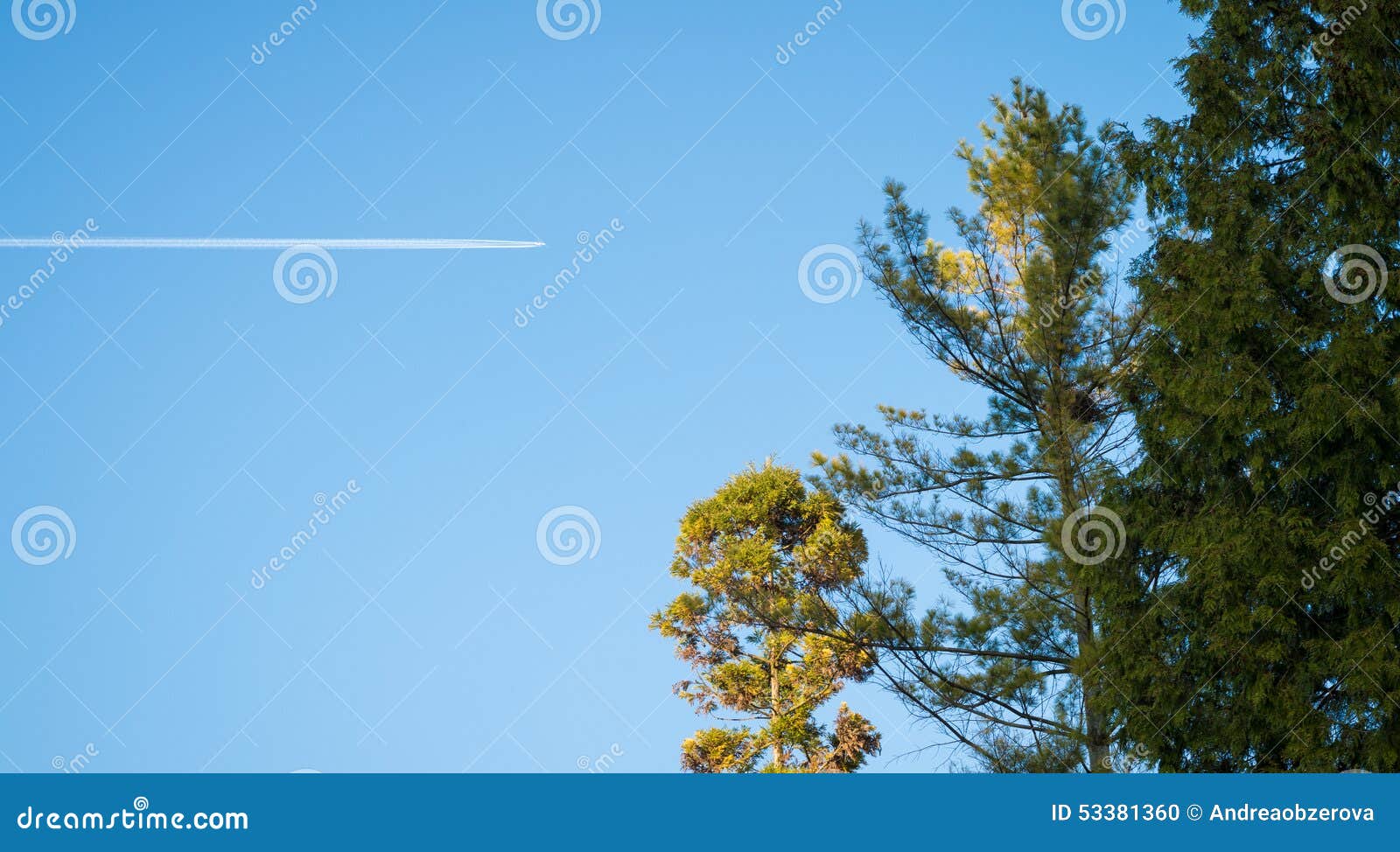 airplane contrail against clear blue sky