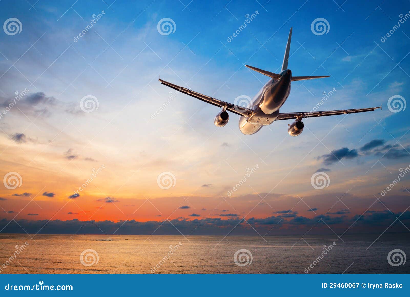 airplane flying at sunset