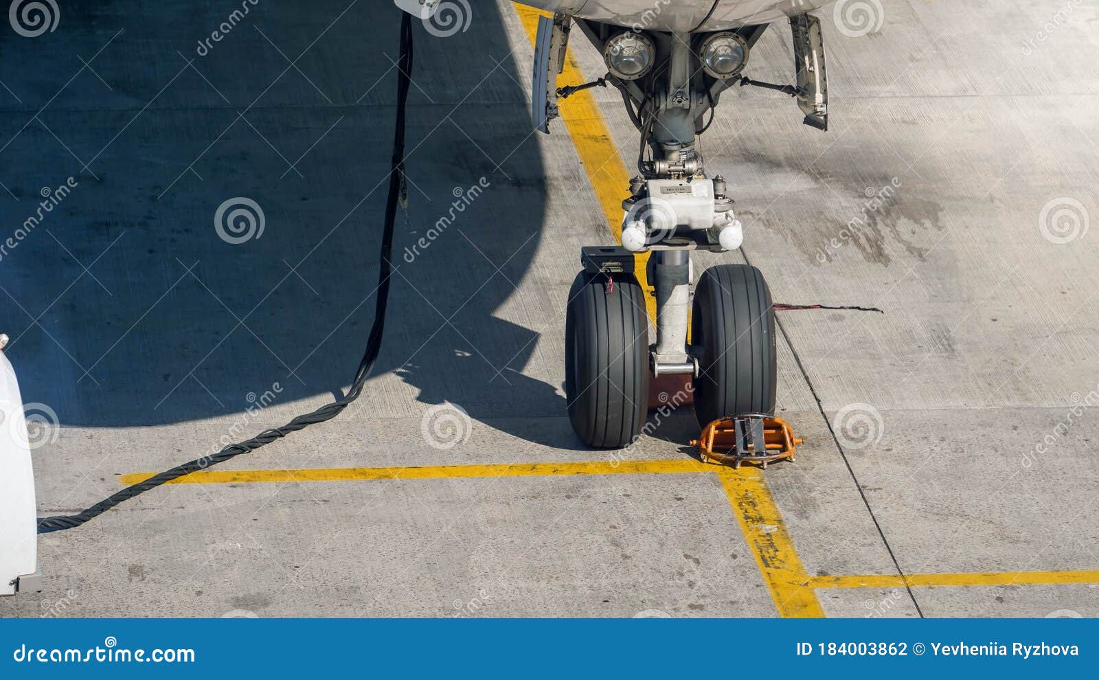 Airplane Front Chassis Parked in Airport during Airplane Checking and