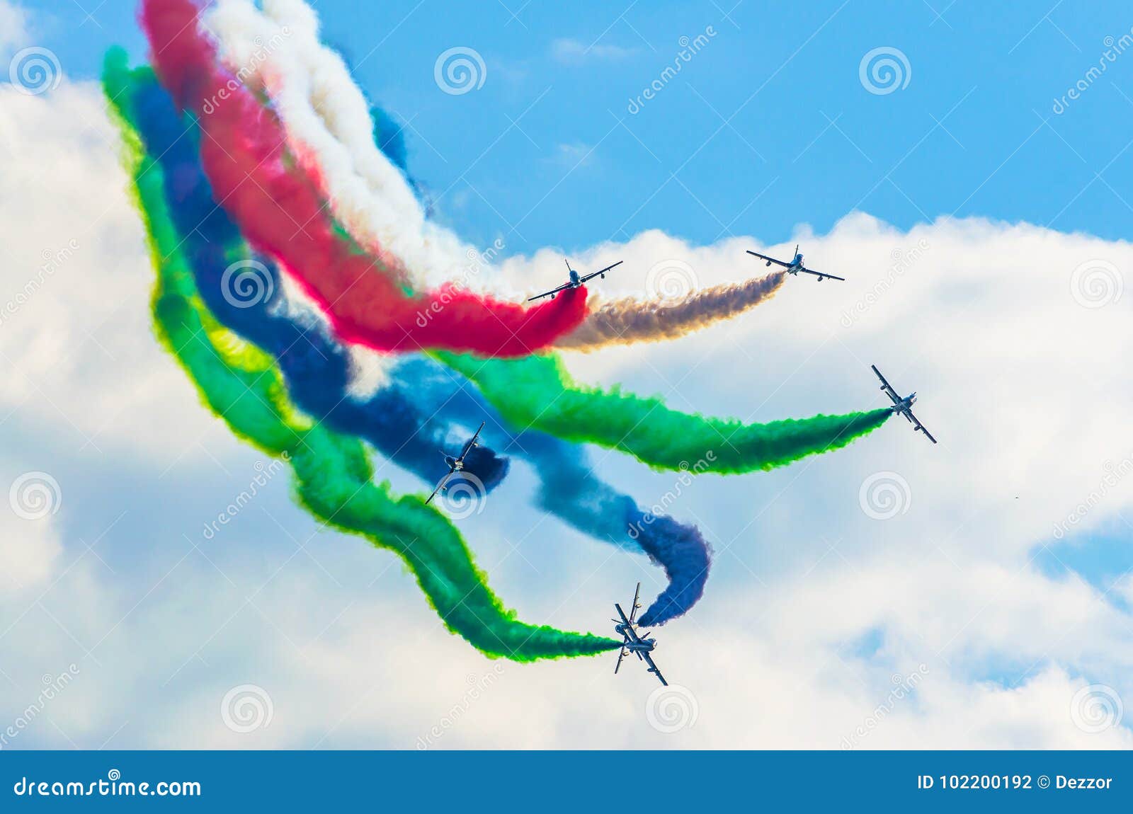 Airplane Group Fighter Against the Background of Color Smoke. Stock