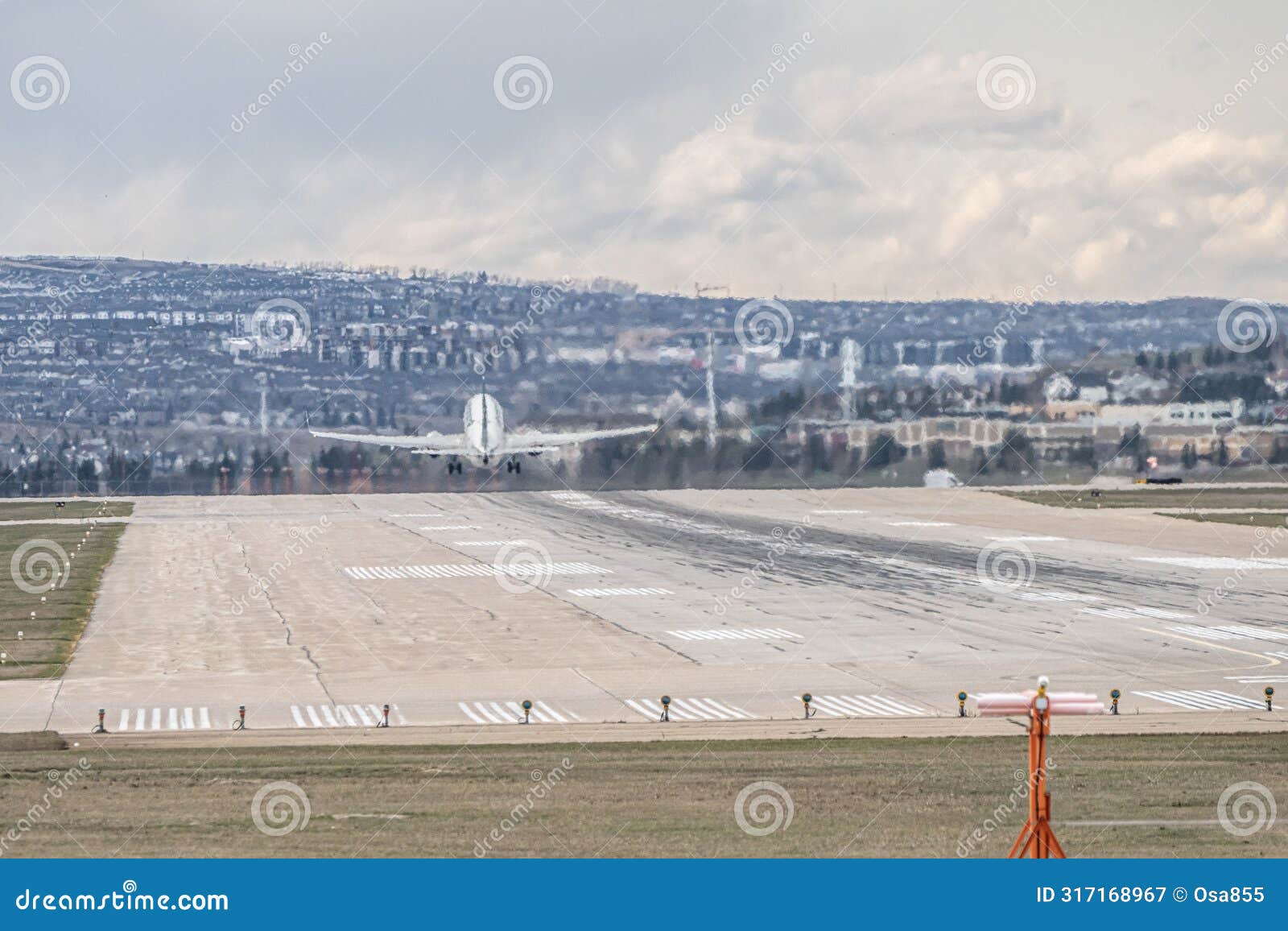 airplane jetliner departing at airport runway