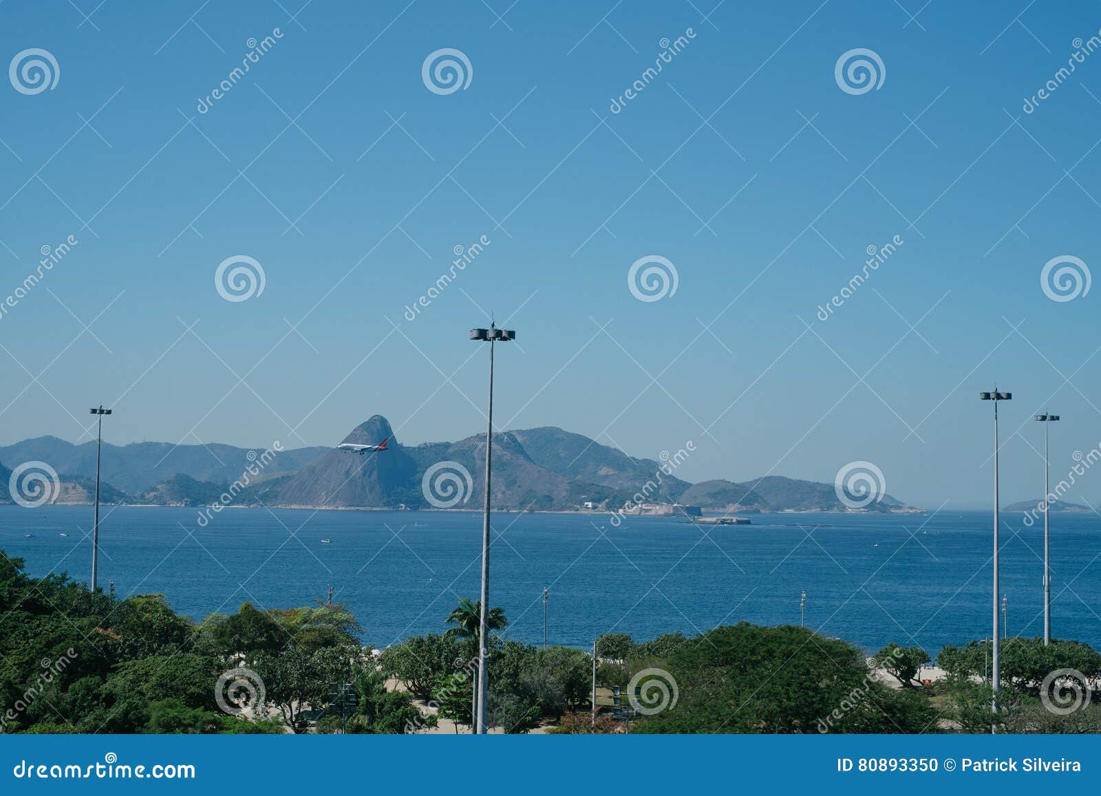 airplane landing in rio de janeiro over beach