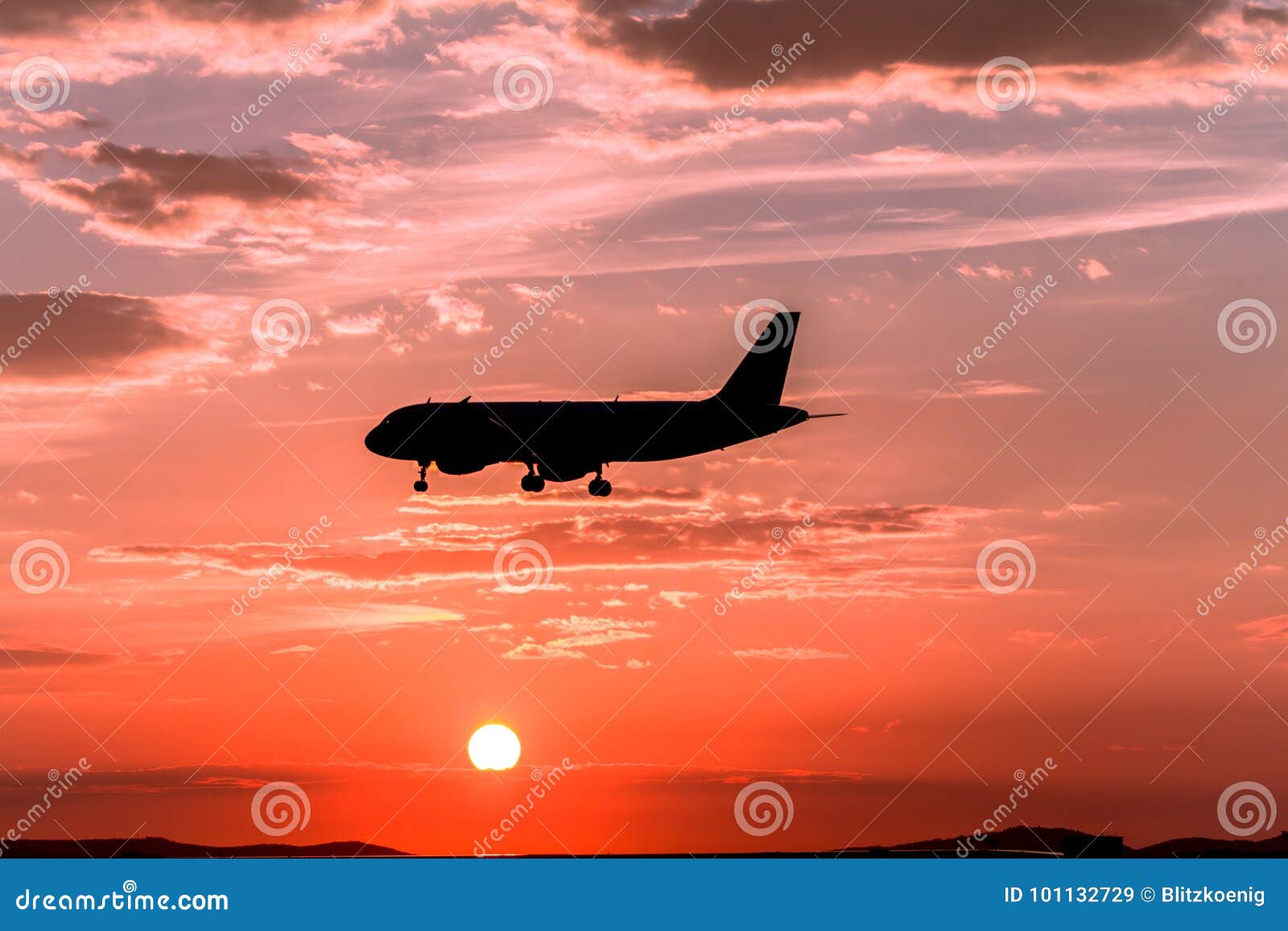 Airplane landing at sunset stock image. Image of passenger - 101132729