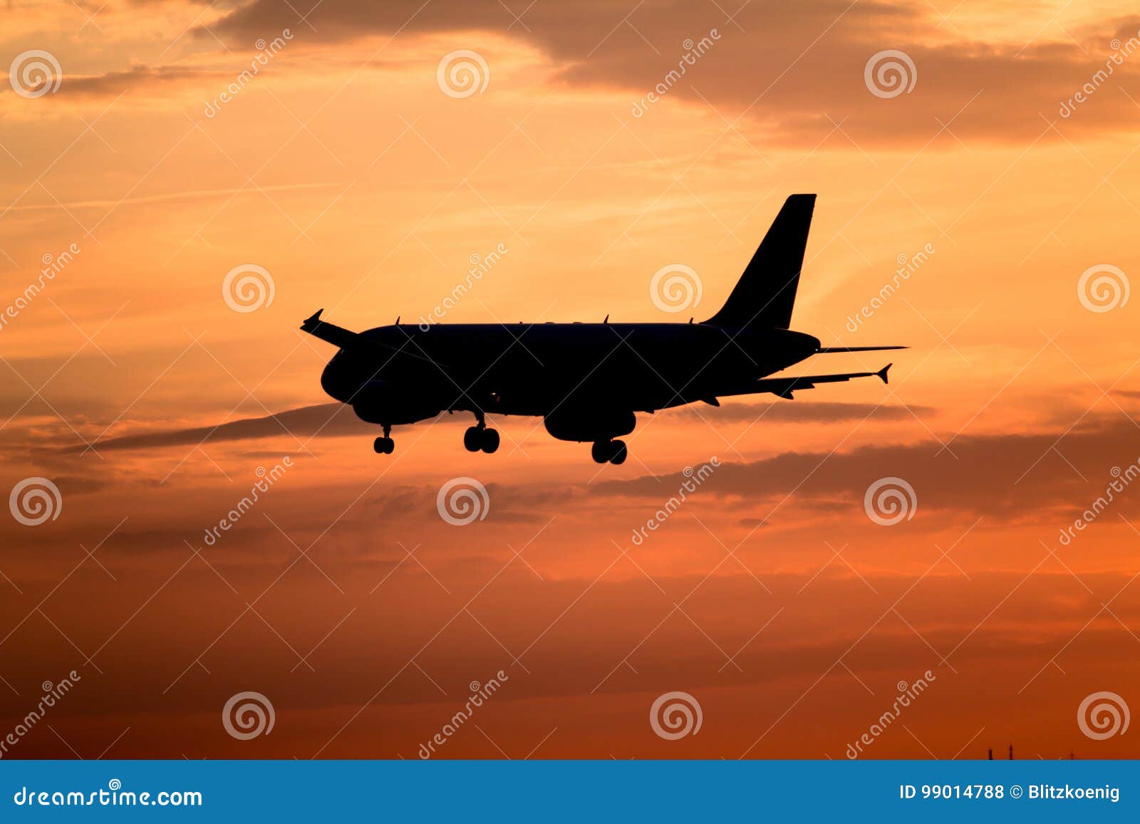 Airplane landing at sunset stock photo. Image of speed - 99014788