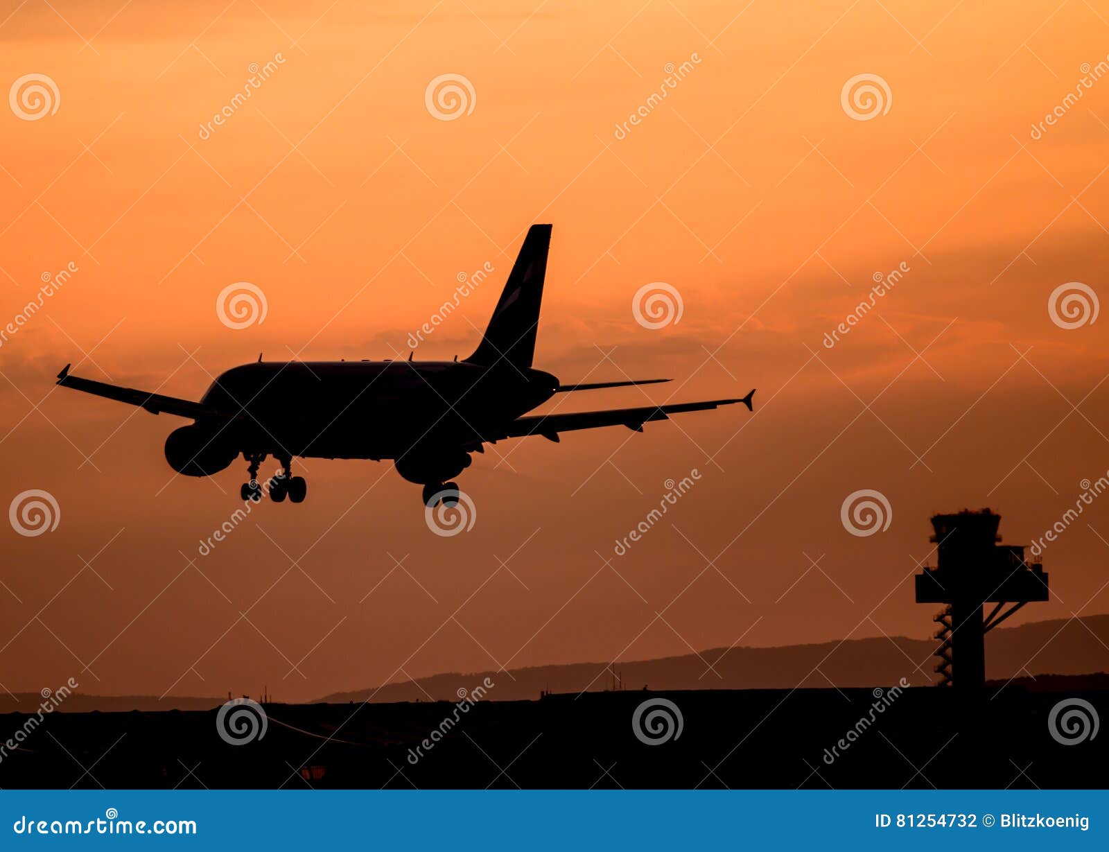 Airplane landing at sunset stock photo. Image of frankfurt - 81254732
