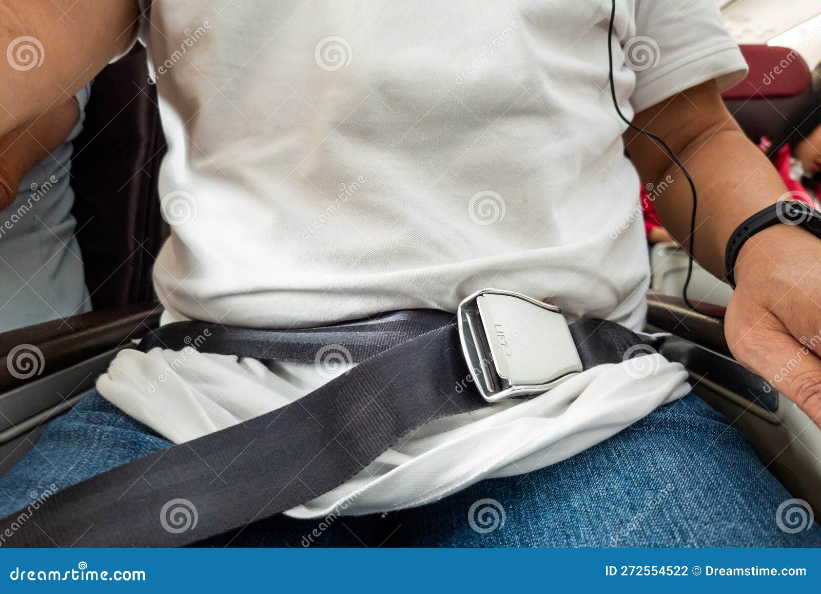 Passenger with Fastened Seat Belt Seated on Aircraft Seat for Safety ...