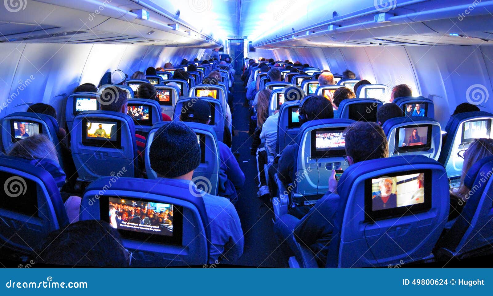 Airplane Passengers, Seats and TV Screens Editorial Stock Image - Image of  corridor, arrival: 49800624