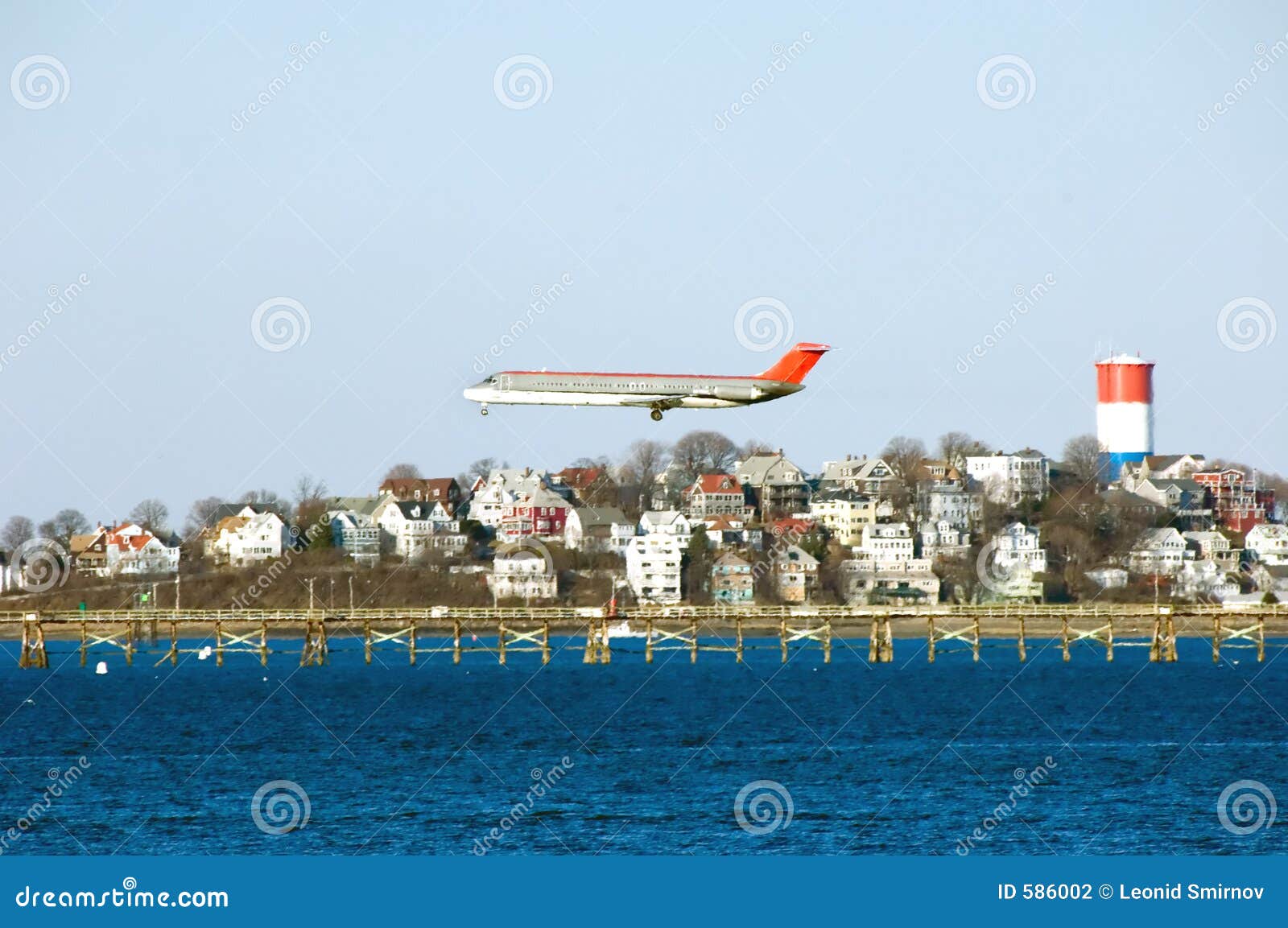 airplane preparing for landing at logan airport.
