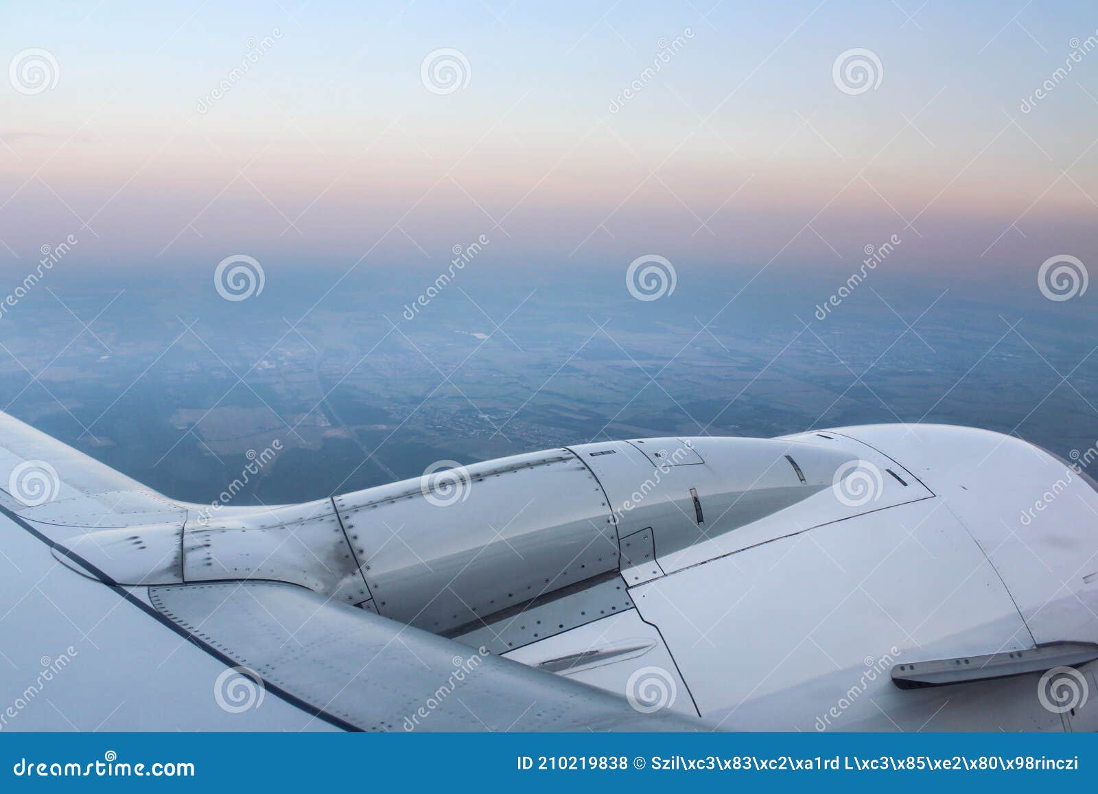 airplane wing with turbina in the air.