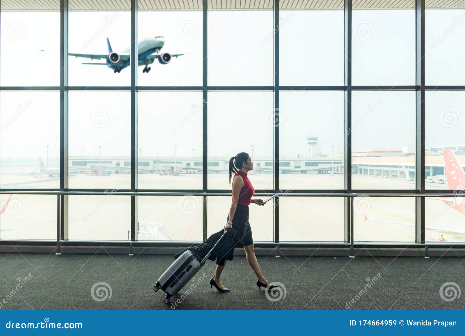 Airport Background. Business Woman Planning Work and Meeting Trip Checking  Board Pass at the Airport Glass Window Stock Image - Image of corporate,  airline: 174664959