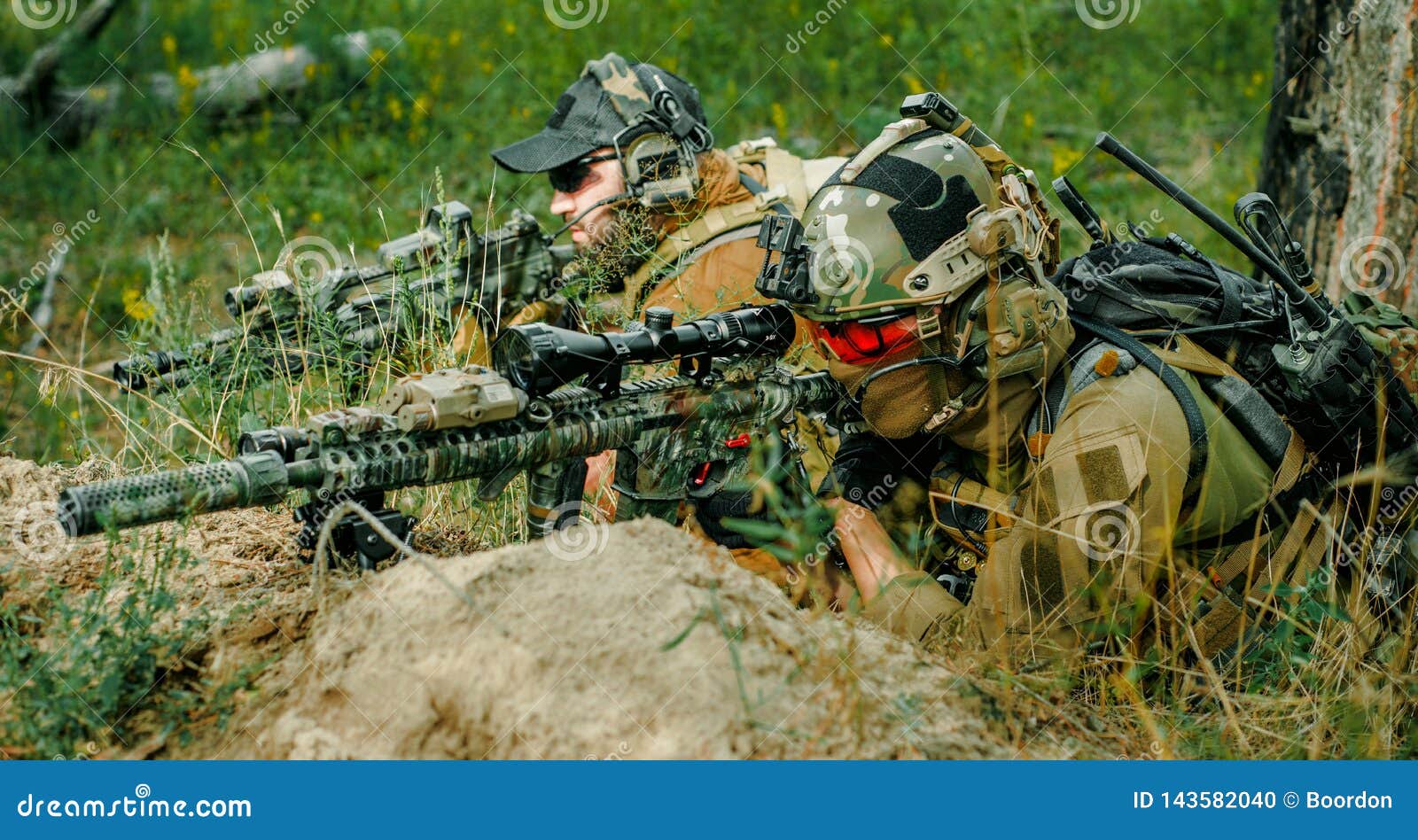 airsoft sniper men with guns lay on hill. sniper and aimer on operation