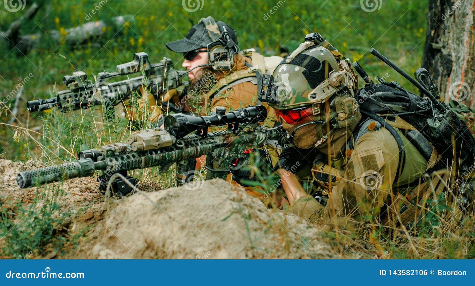 airsoft sniper men with guns lay on hill. sniper and aimer on operation