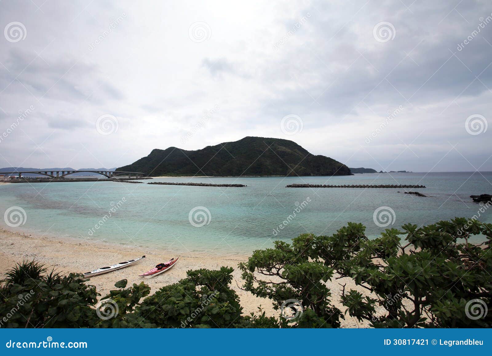 aka bridge and zamami island under cloudy sky