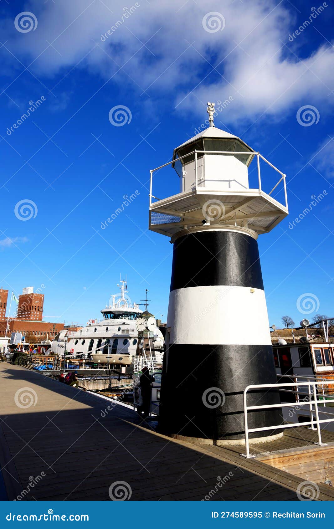 lighthouse of aker brygge marina in oslo, norway, europe