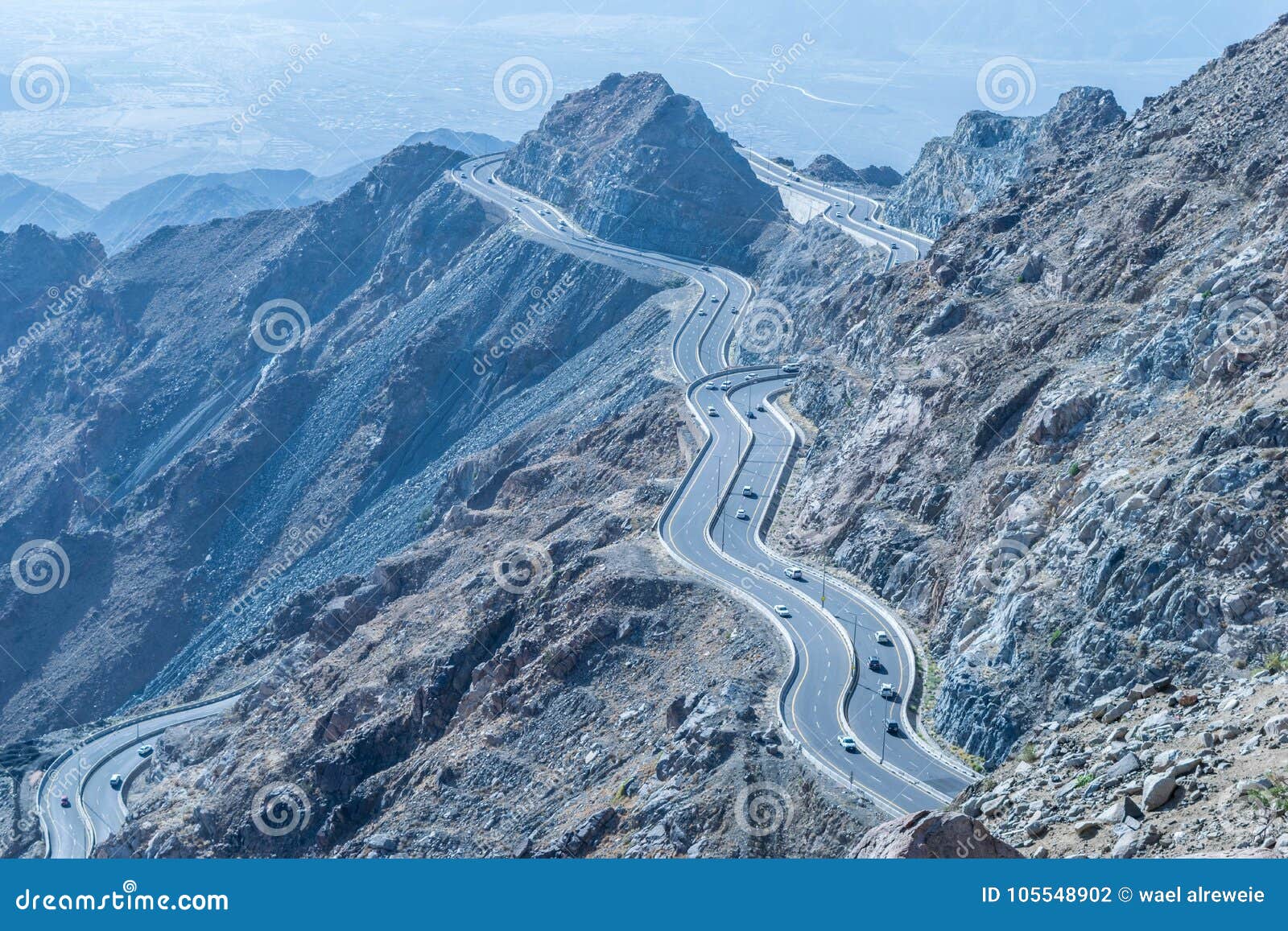 al hada mountain in taif city, saudi arabia with beautiful view of mountains and al hada road inbetween the mountains.