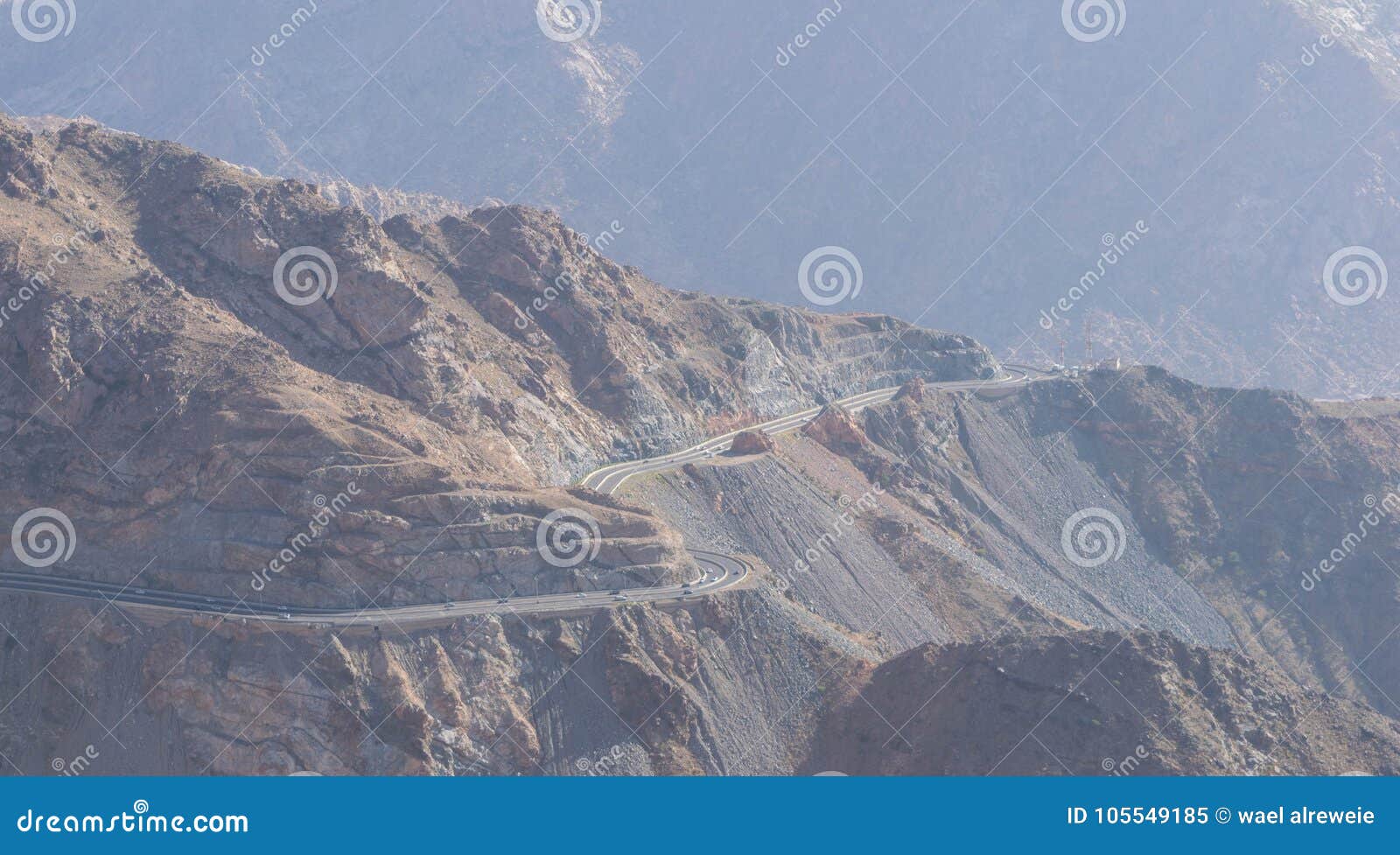 al hada mountain in taif city, saudi arabia with beautiful view of mountains and al hada road inbetween the mountains.