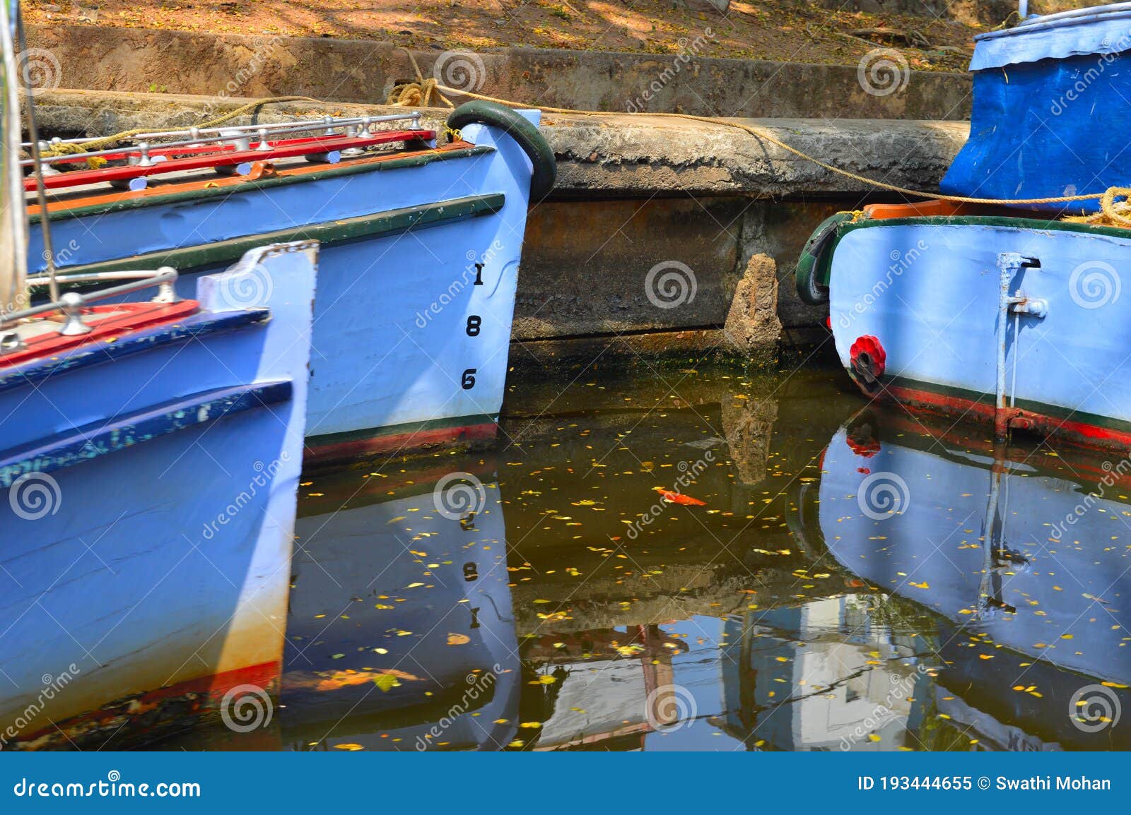 Parts of Boats with Its Reflection in Water Stock Image - Image of