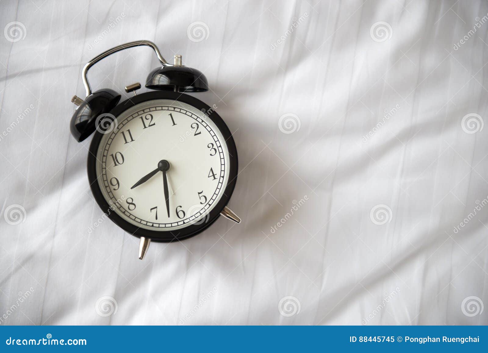 Alarm clock on bed stock image. Image of sheet, bell 88445745