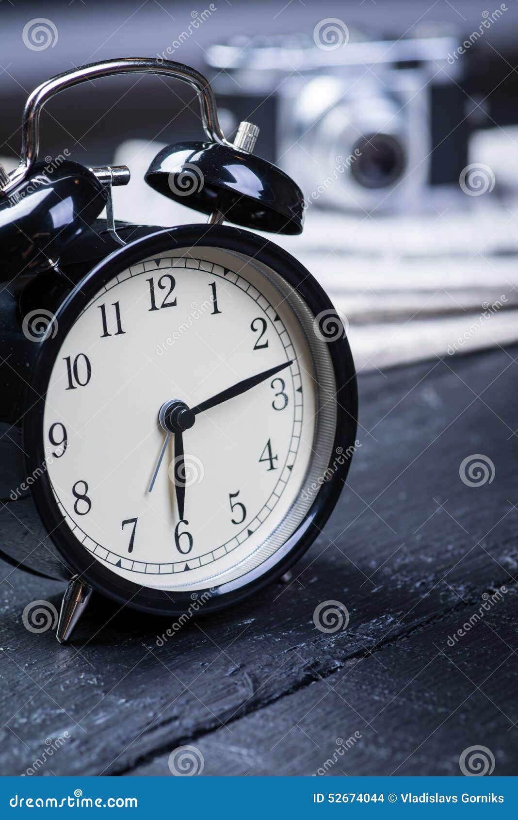 Alarm Clock with Camera and Newspaper on Table Stock Photo Image of