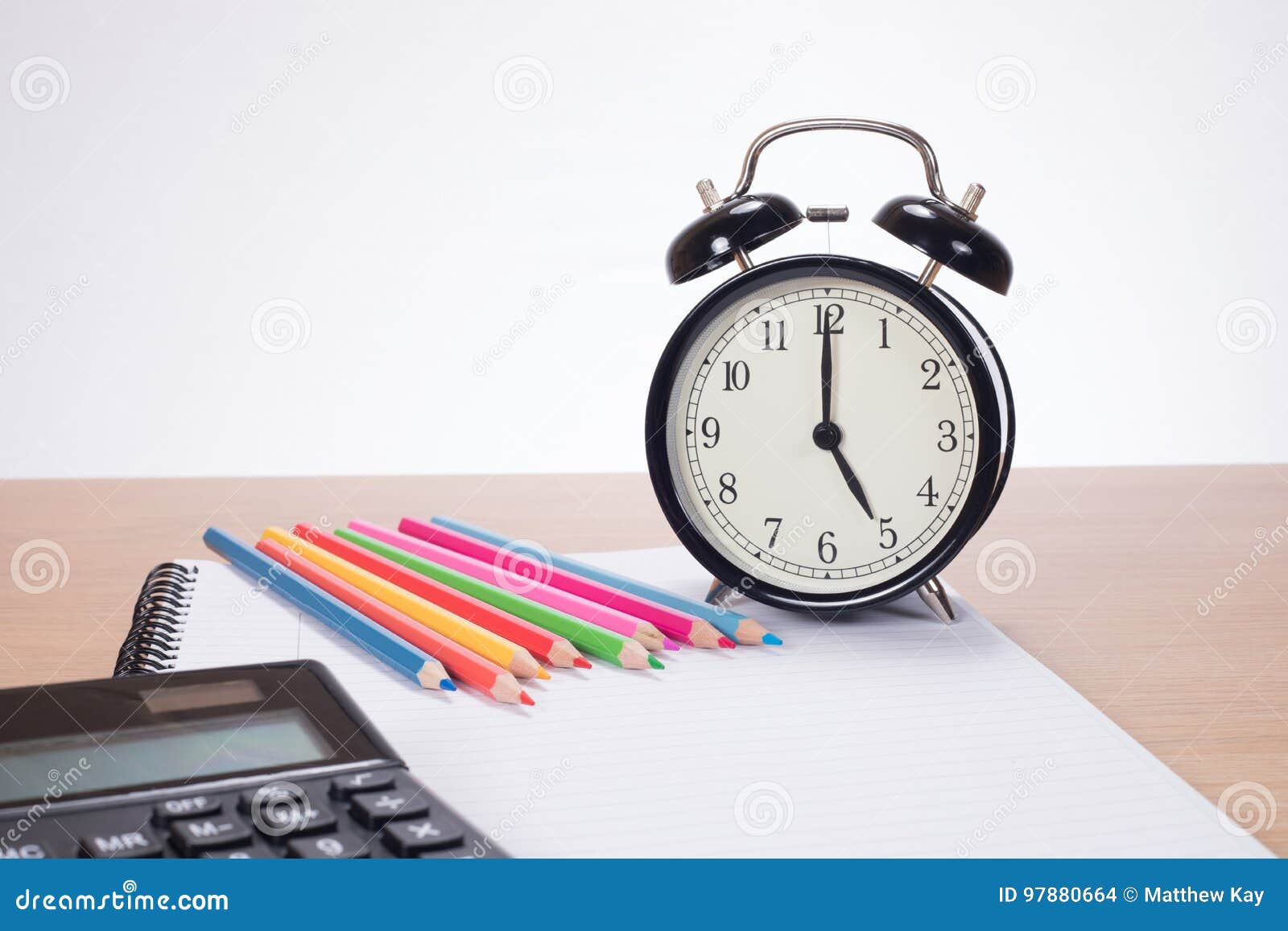 Alarm Clock among Colored Pencils and Notebook Stock Photo Image of