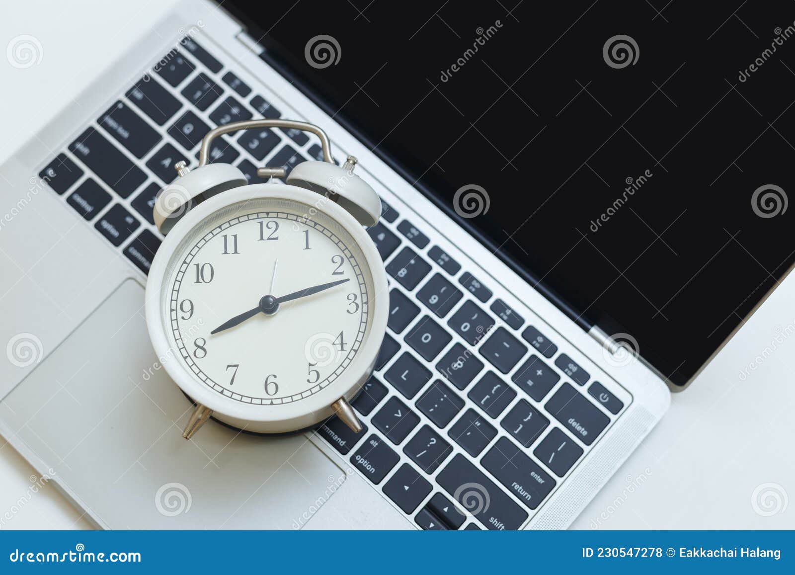Alarm Clock on Computer Laptop on Table. Stock Photo Image of desk