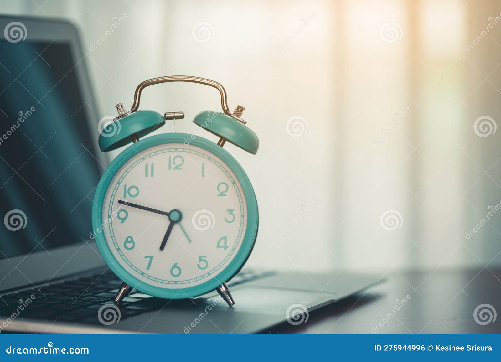 An alarm clock on laptop stock photo. Image of deadline 275944996