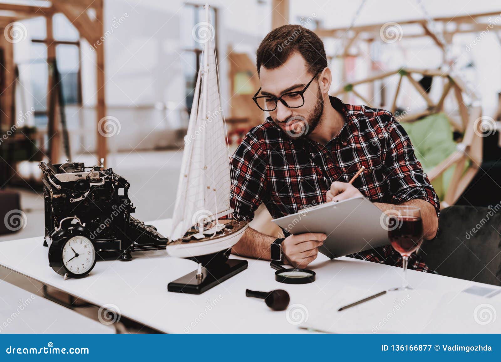 alarm clock. model of ship. project. laptop