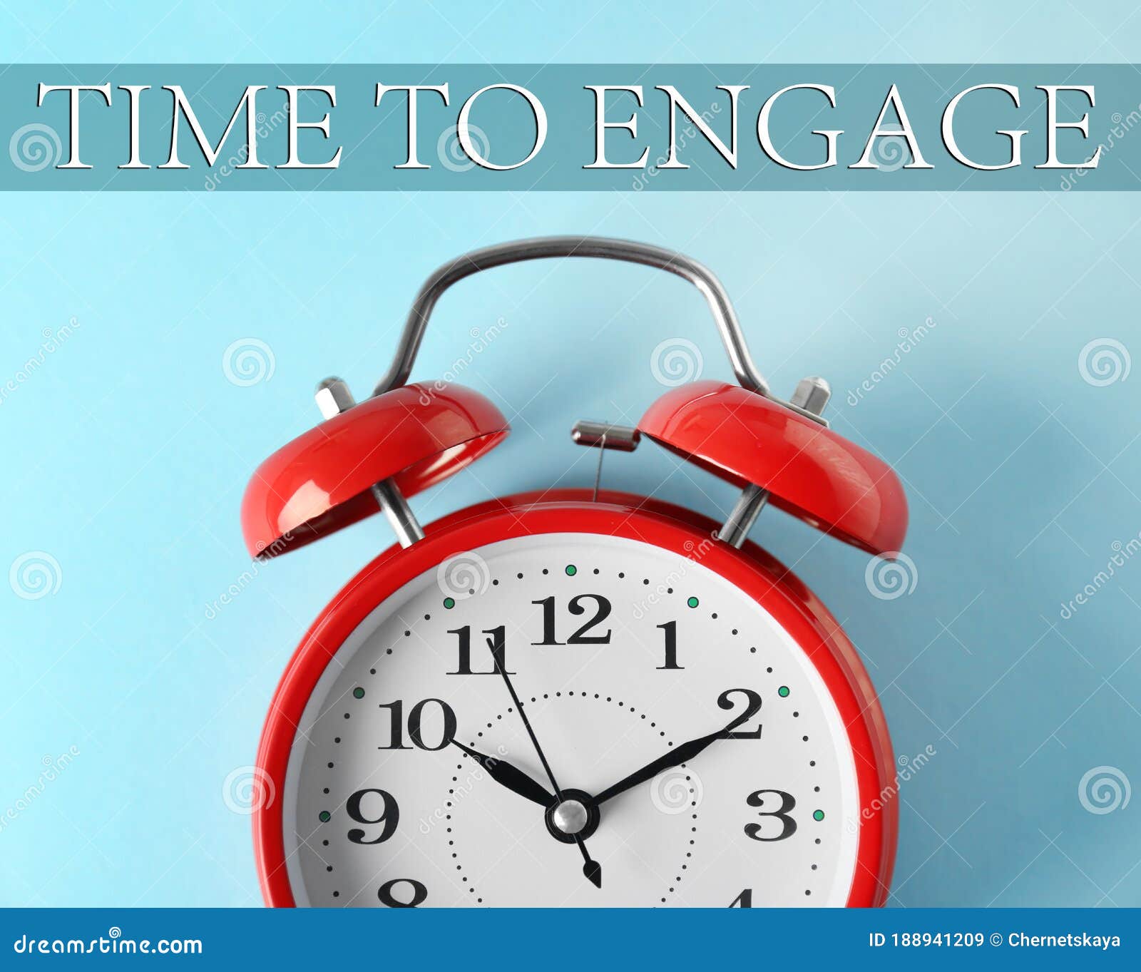 Alarm Clock and Phrase TIME TO ENGAGE on Blue Background, Closeup Stock